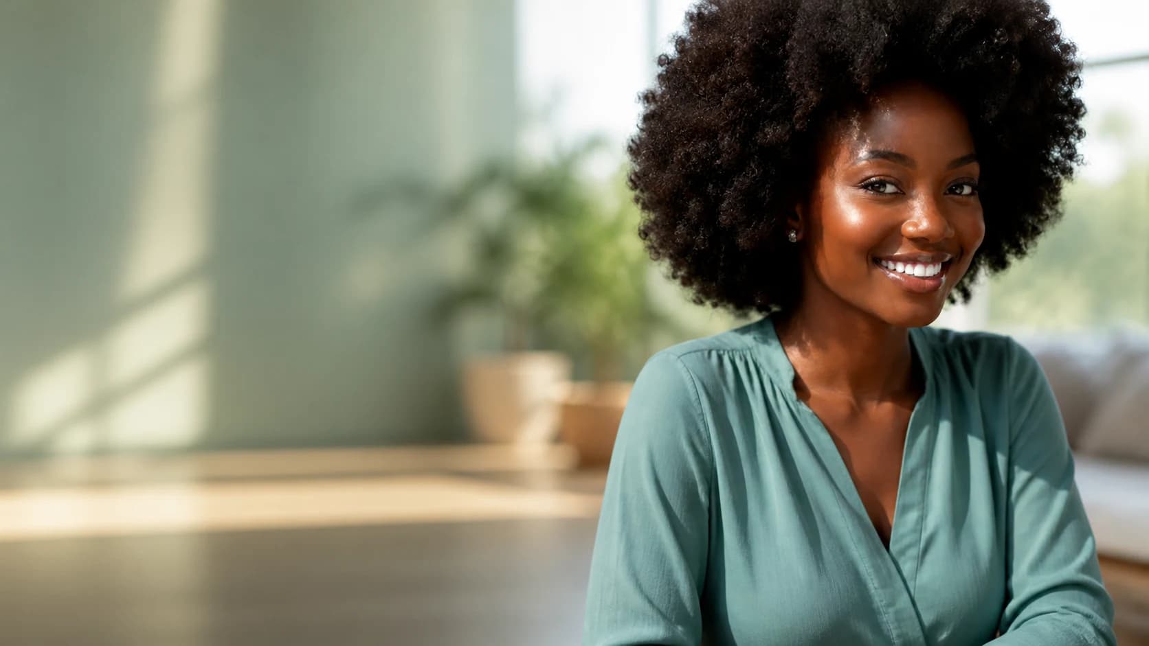 African woman with a natural afro in a bright, welcoming wellness setting