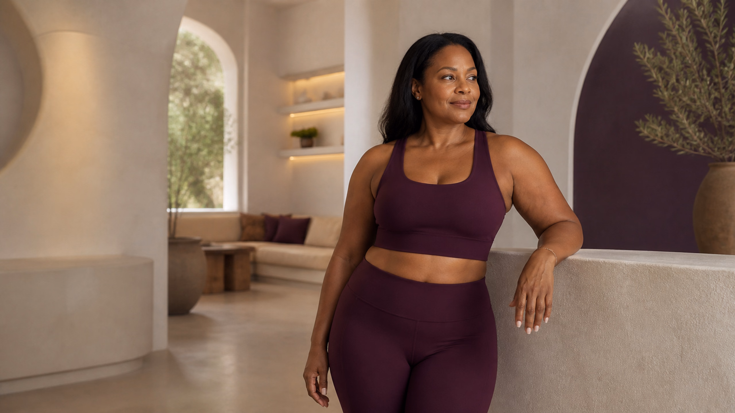 Woman in athletic wear preparing for a CoolSculpting consultation