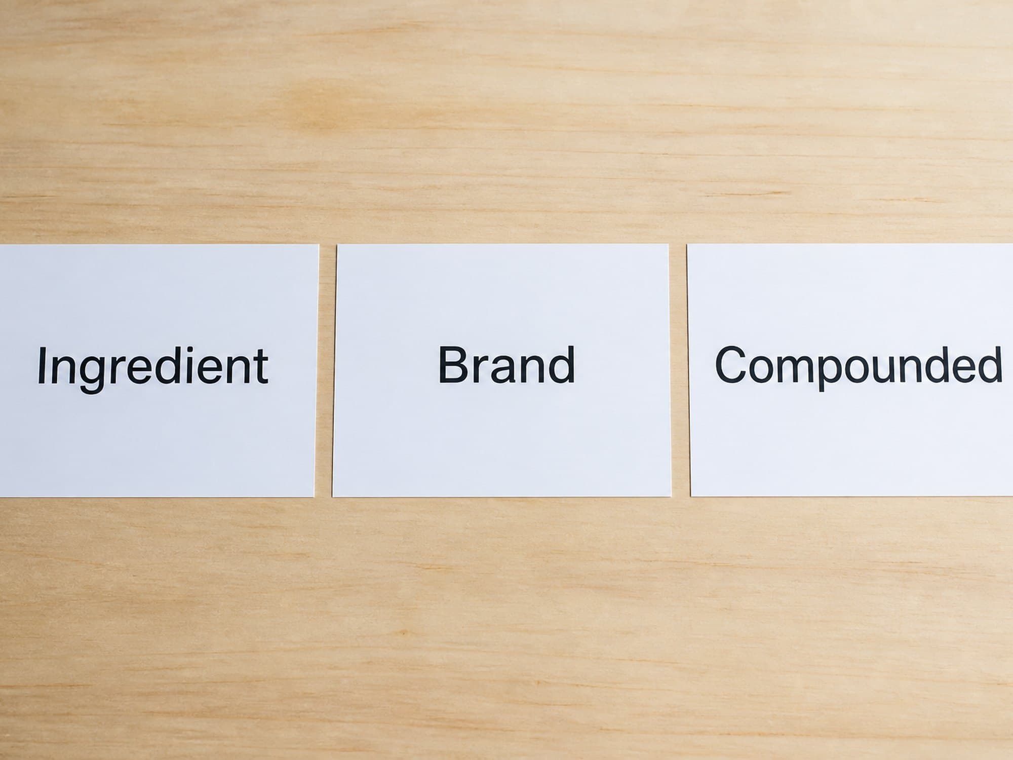 Three printed cards labeled Ingredient, Brand, and Compounded