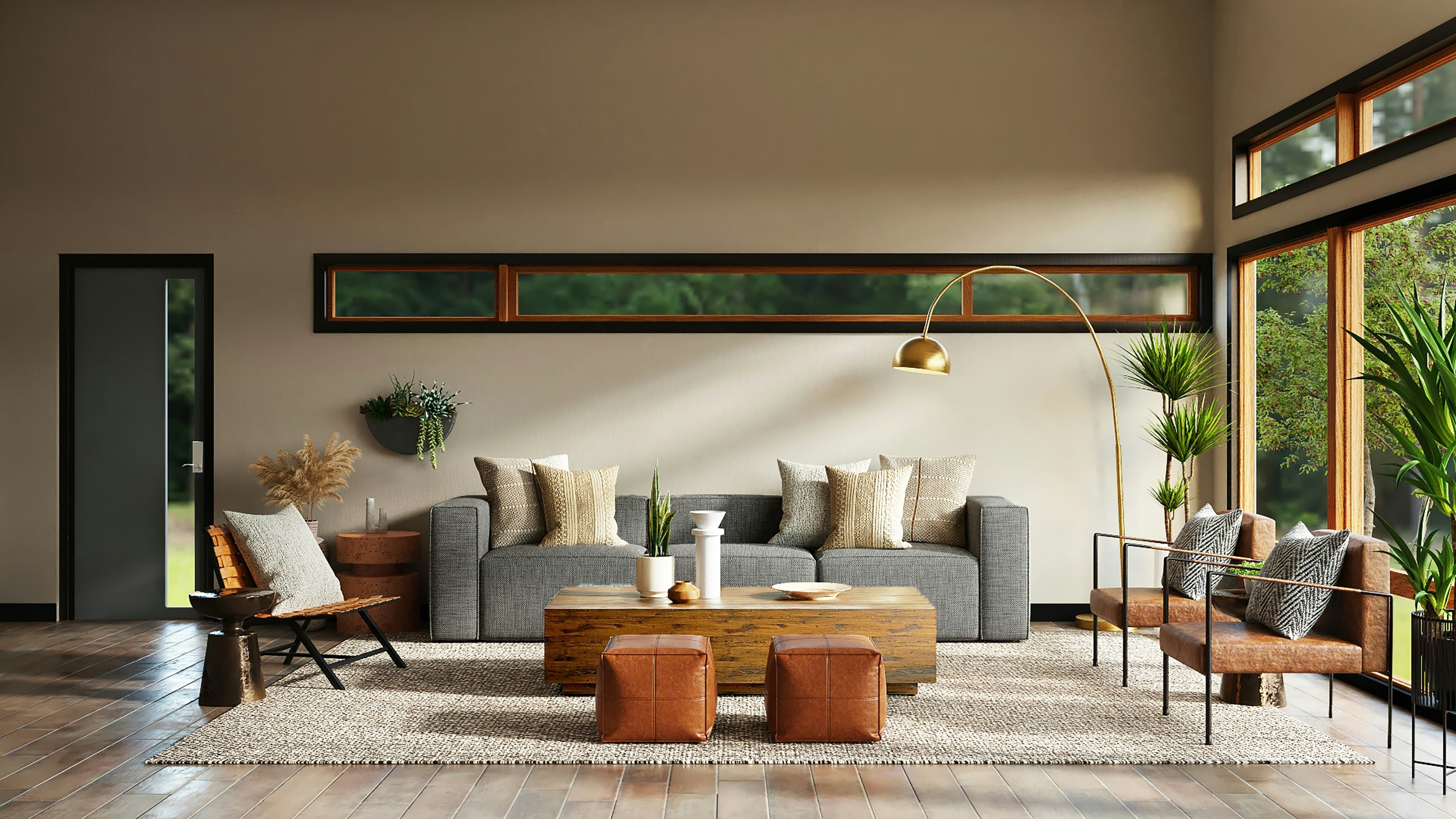A modern lounge with a grey sofa, wood table, and garden windows