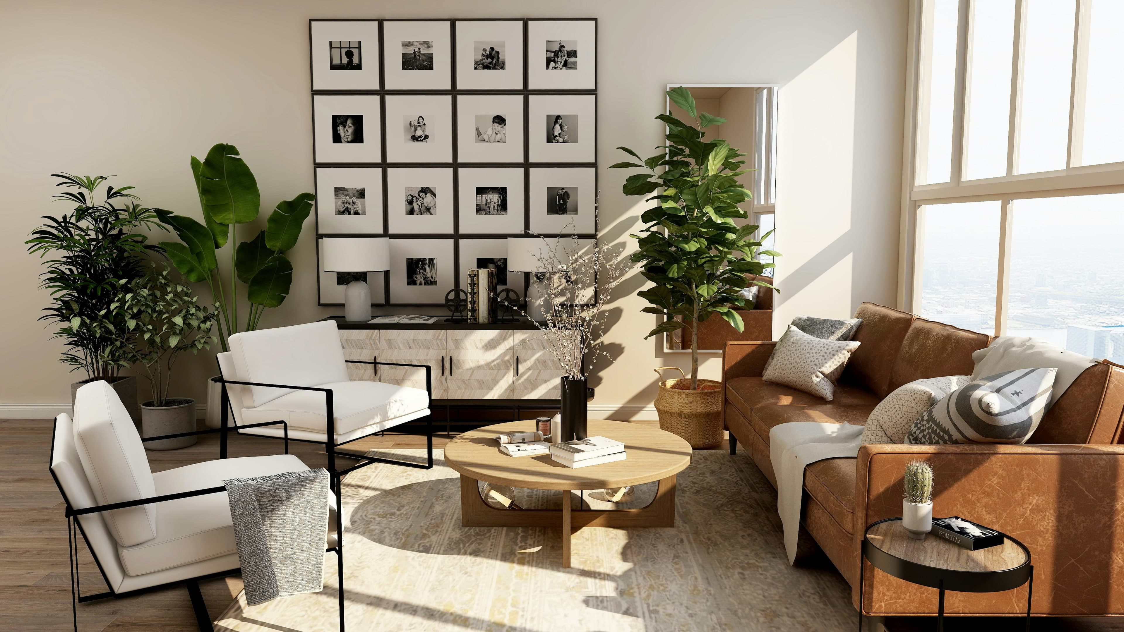 A bright sitting room with white chairs, a cognac sofa, and a grid of framed photographs