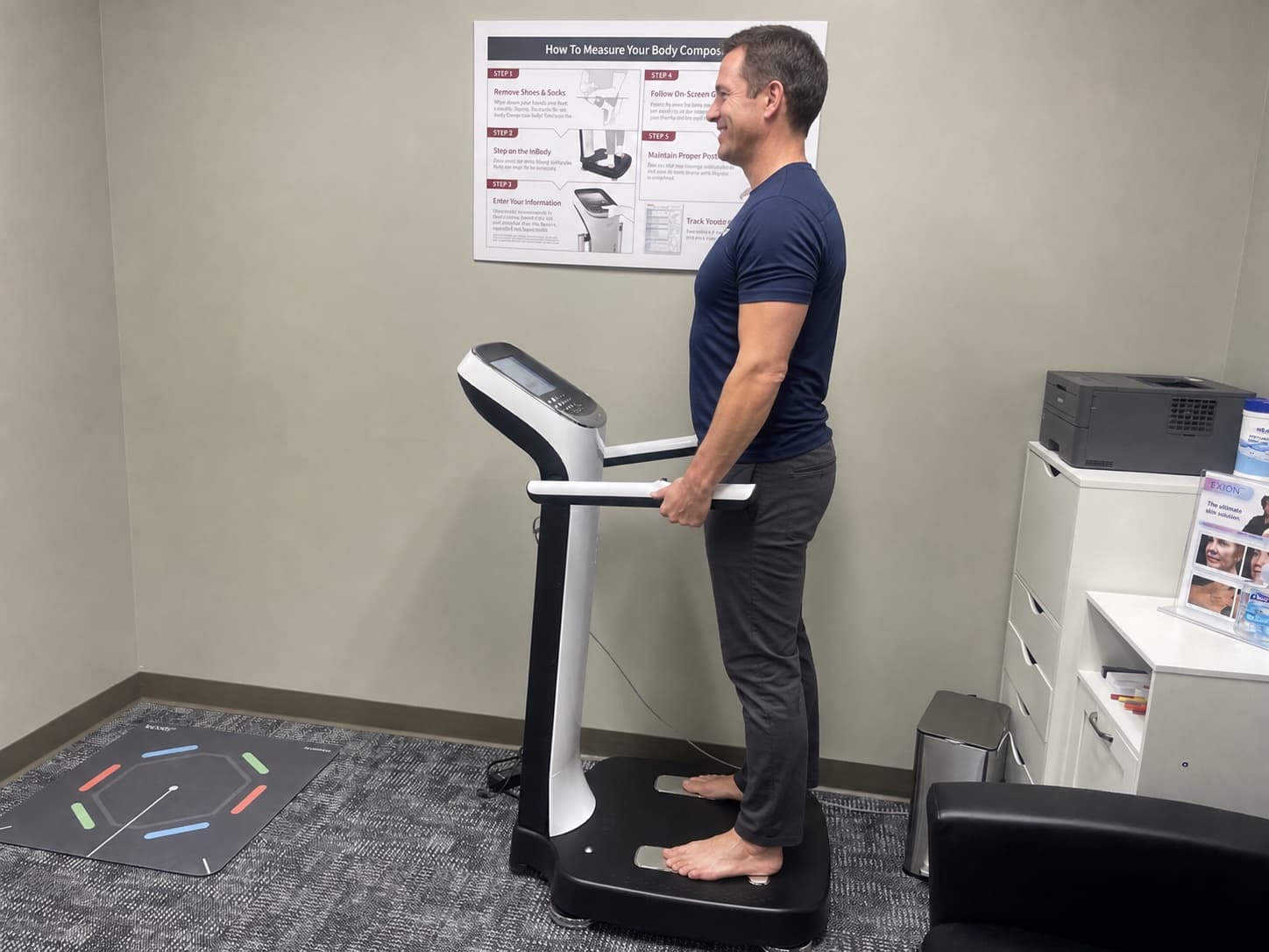 Healthy adult man using the InBody body composition analyzer at WellForm MD