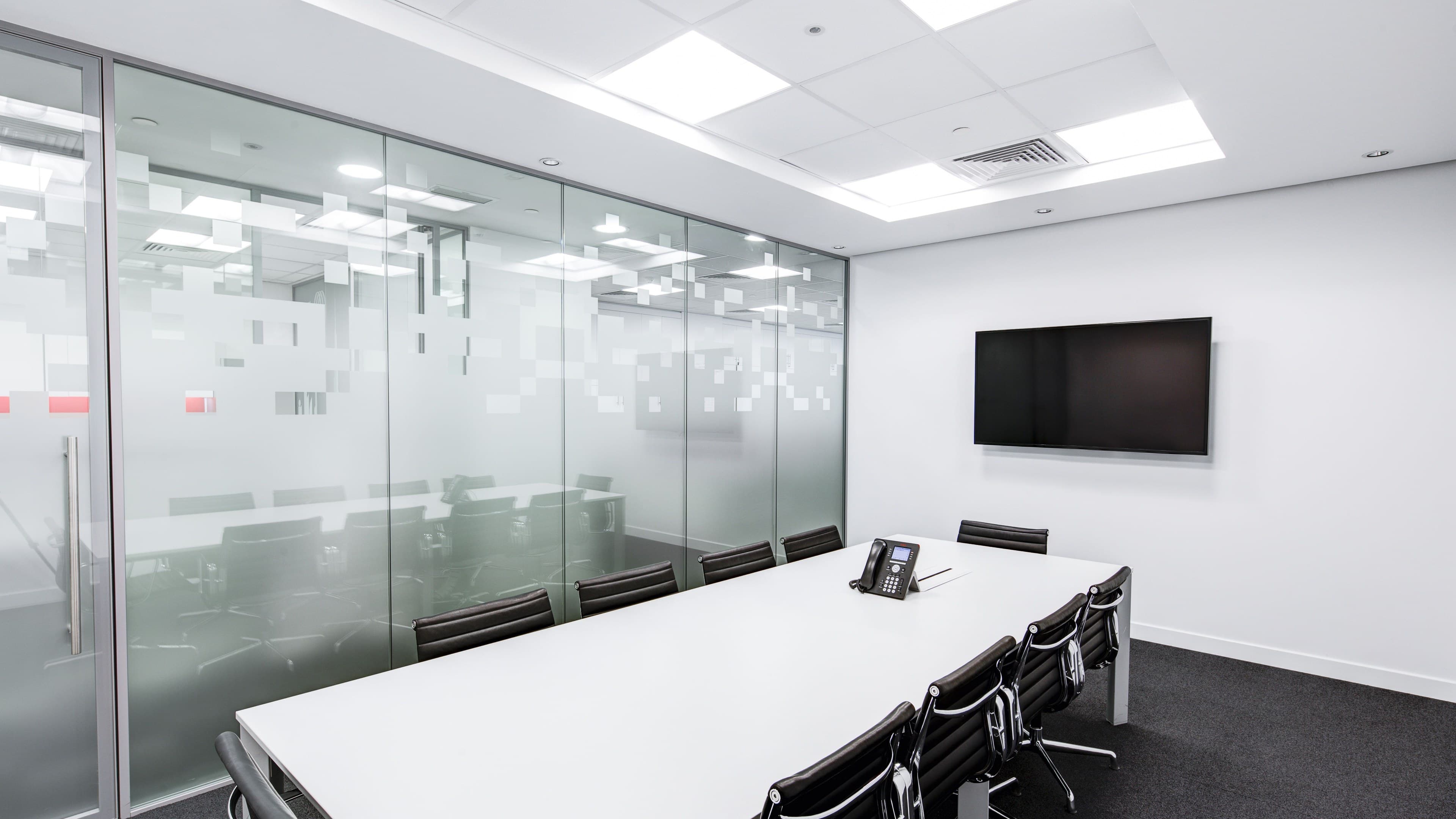 A bright consultation room with a conference table