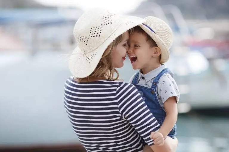 media large happy mom holding son